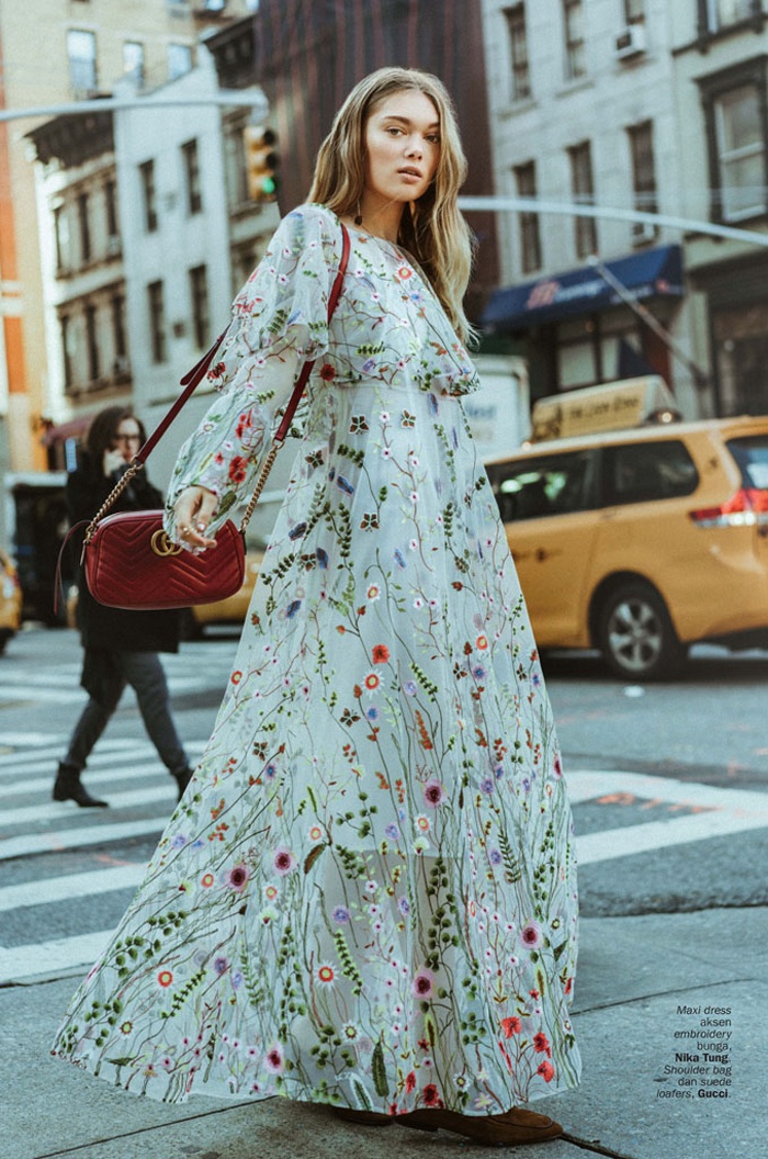 Posing in the streets, Puck Loomans wears Nika Tung maxi dress and Gucci shoulder bag