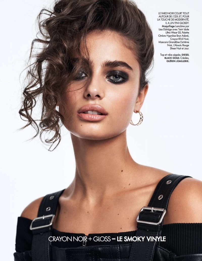 Model Taylor Hill poses with charcoal eyeshadow and glossy lips
