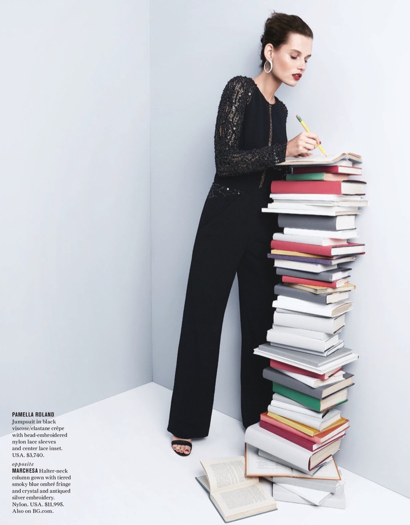 Checking her book list, the model wears Pamella Roland jumpsuit