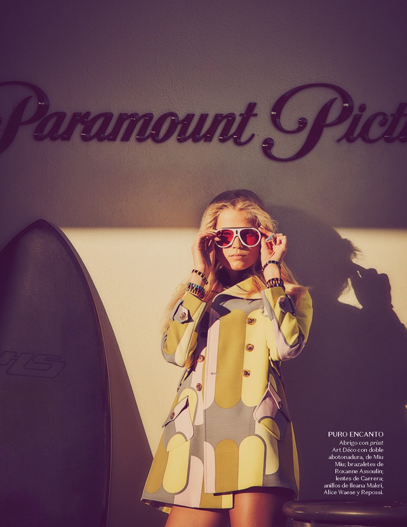 Looking retro glam, Vita Sidorkina wears Miu Miu printed jacket and Carrera sunglasses