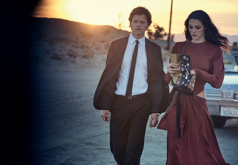 Model Vittoria Ceretti poses in Louis Vuitton dress with bag also from the label