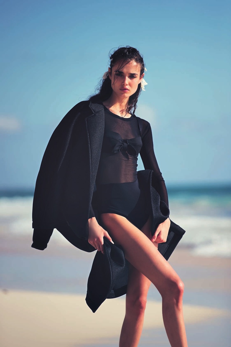 Blanca Padilla poses in Max Mara coat, bodysuit, bra and briefs