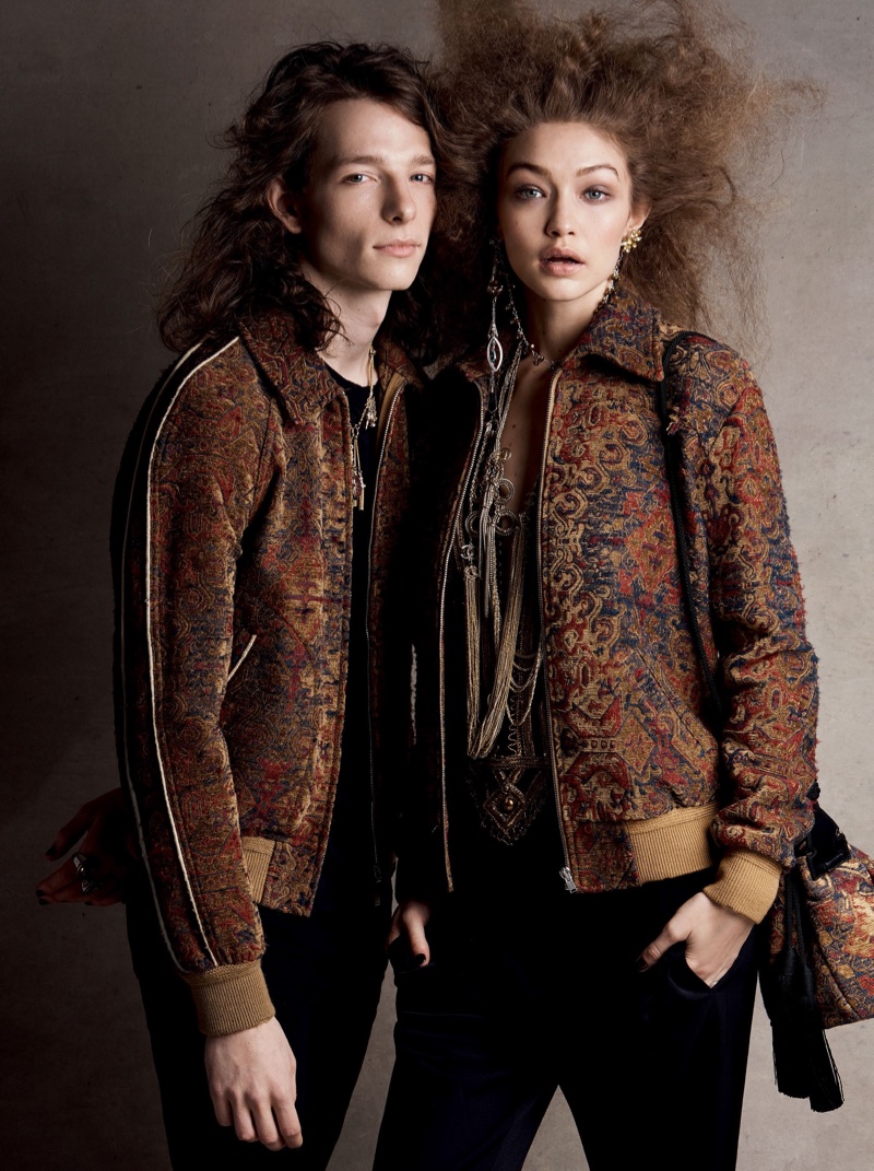 Gigi Hadid models Saint Laurent jacket, blouse, jeans and bag