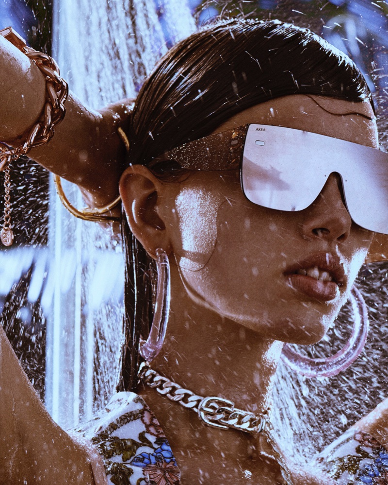 Focus on accessories with a Fendi swimsuit, Area sunglasses and earrings. Necklace from Lace by Tanaya.