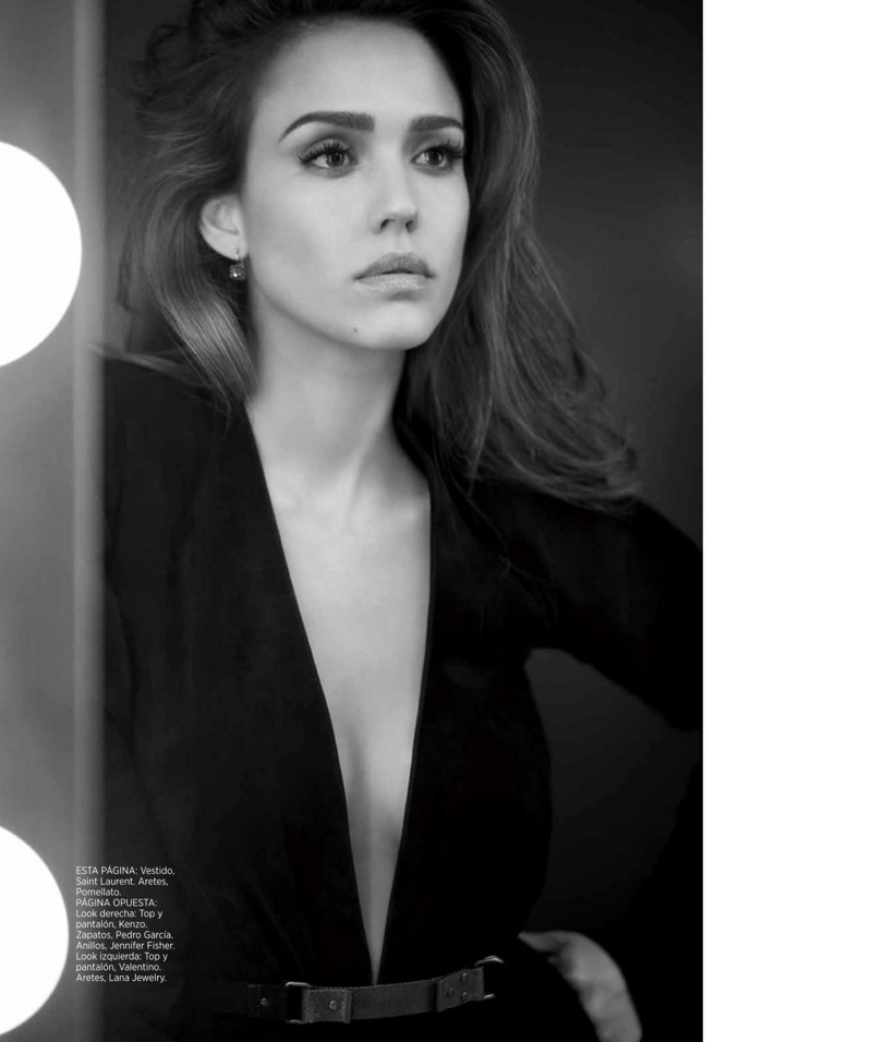Looking in the mirror, Jessica Alba poses in Saint Laurent dress