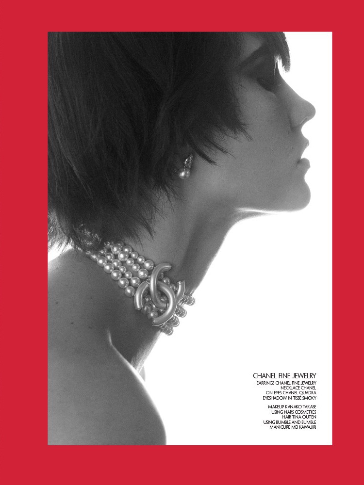 Model Karlie Kloss wears Chanel Fine Jewelry choker necklace and earrings