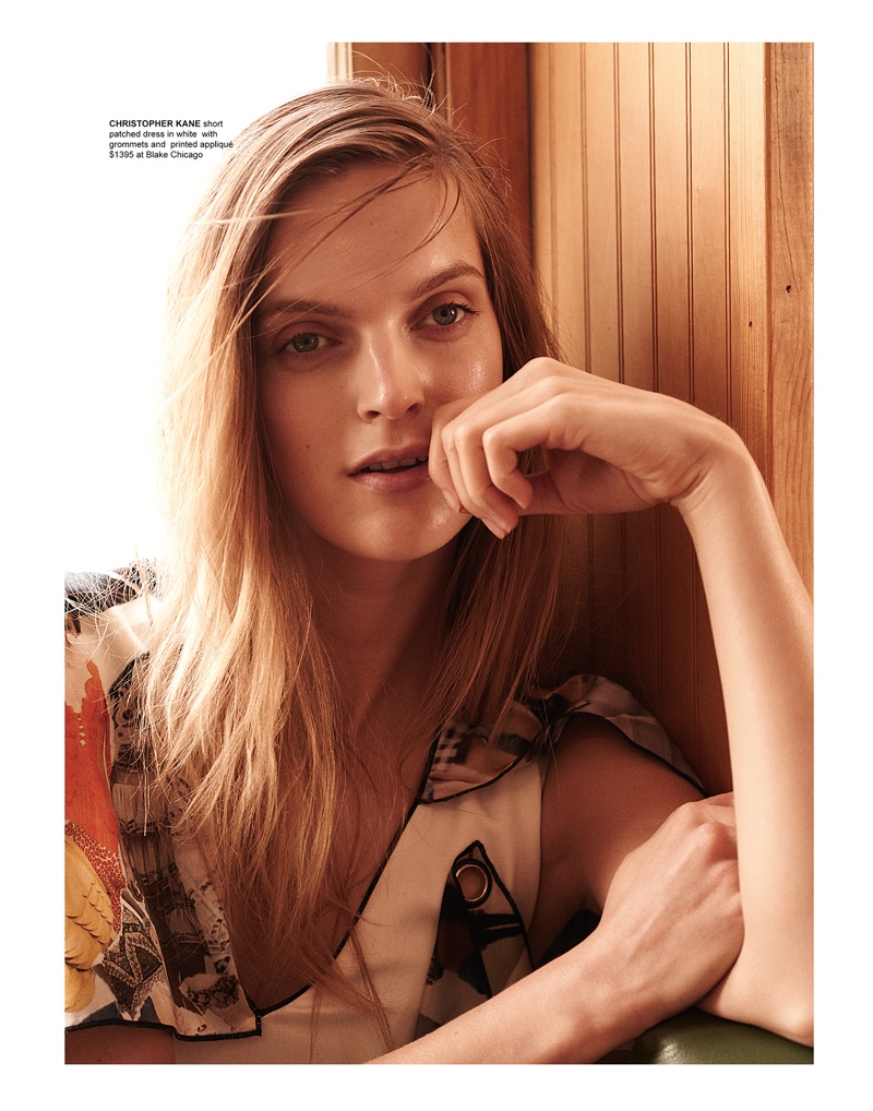 Getting her closeup, Mirte Maas models Christopher Kane short patched dress with grommets and printed appliqué 