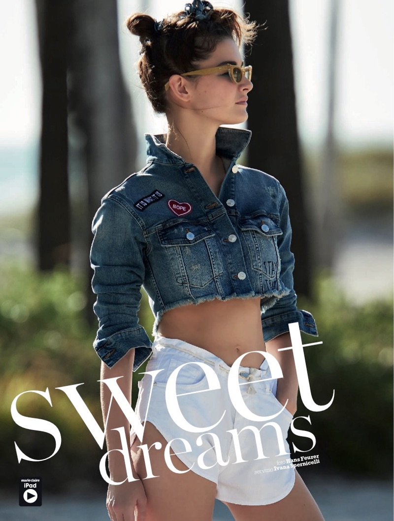 Flaunting her toned figure, Ophelie Guillermand wears Guess Jeans denim jacket and denim shorts from Pinko with Just Cavalli sunglasses