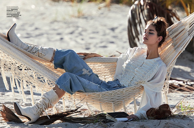 Lounging in a hammock, Ophelie Guillermand models Ermanno Scervino blouse, MM6 Maison Margiela jeans and Philosophy di Lorenzo Serafini boots