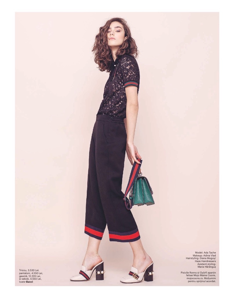 Model Ada Tache wears Gucci lace shirt, pants, loafers and bags