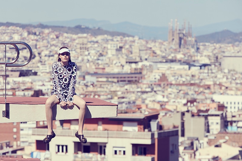Carlotta Brass wears Christopher Kane floral embellished dress, Lacoste visor and Crocs x Christopher Kane sandals