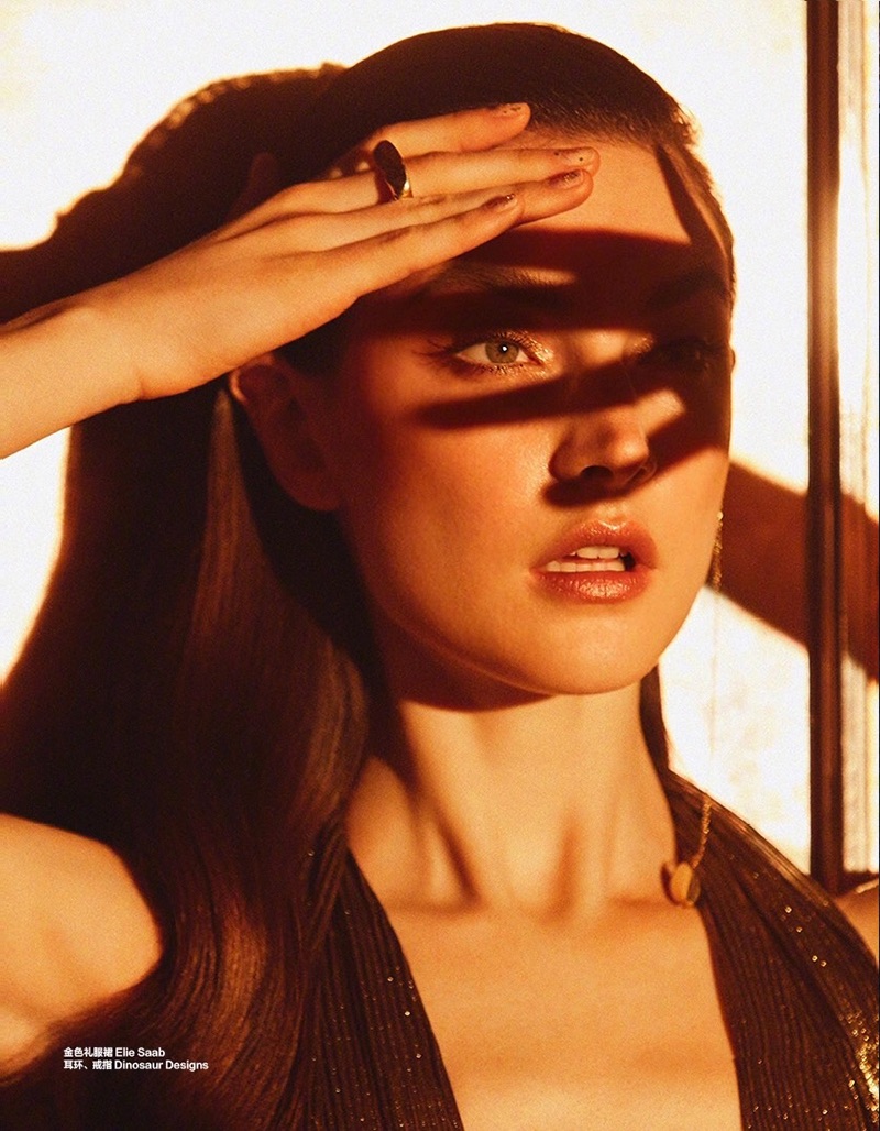 Getting her closeup, Jacquelyn Jablonski models Elie Saab top with Dinosaur Designs jewelry