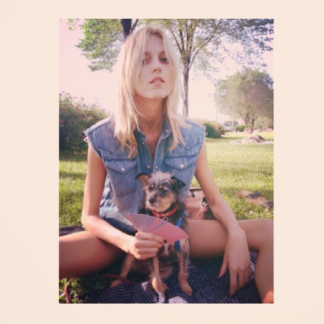 Anja Rubik poses with a dog