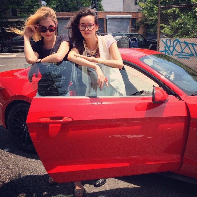 Ashley Smith and Sara Stephens with a red car