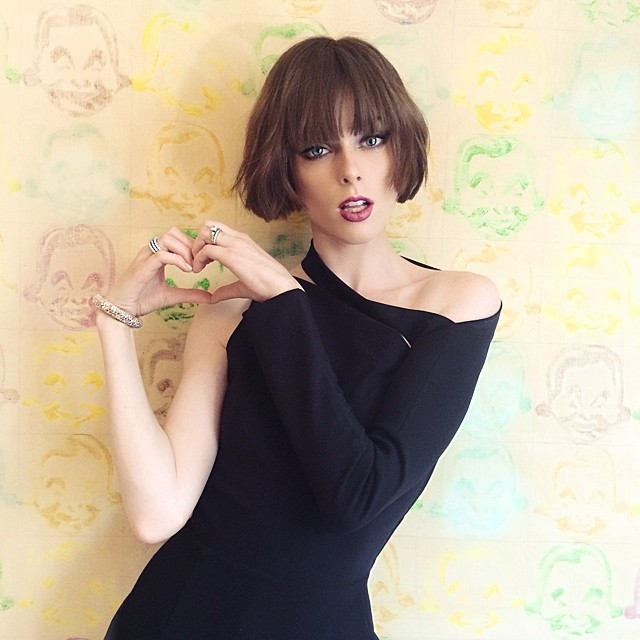 Coco Rocha does a heart sign