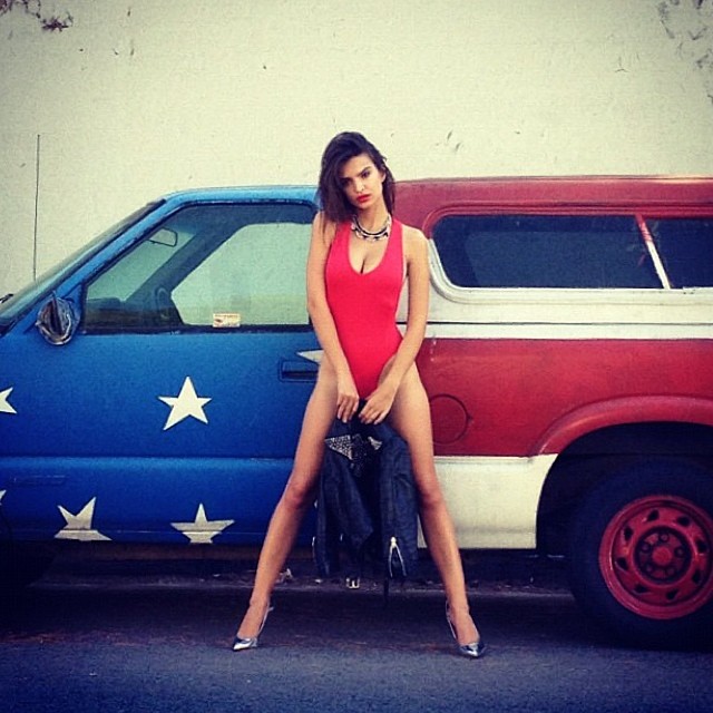 Emily Ratajkowski shared a photo shoot where she posed against a patriotic car