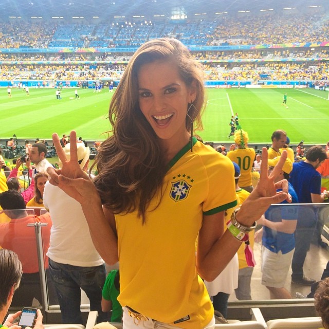 Izabel Goulart roots for Brazil earlier in the week