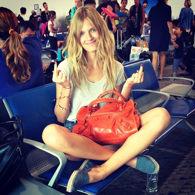 Constance Jablonski flashes the middle finger after an airline loses her luggage
