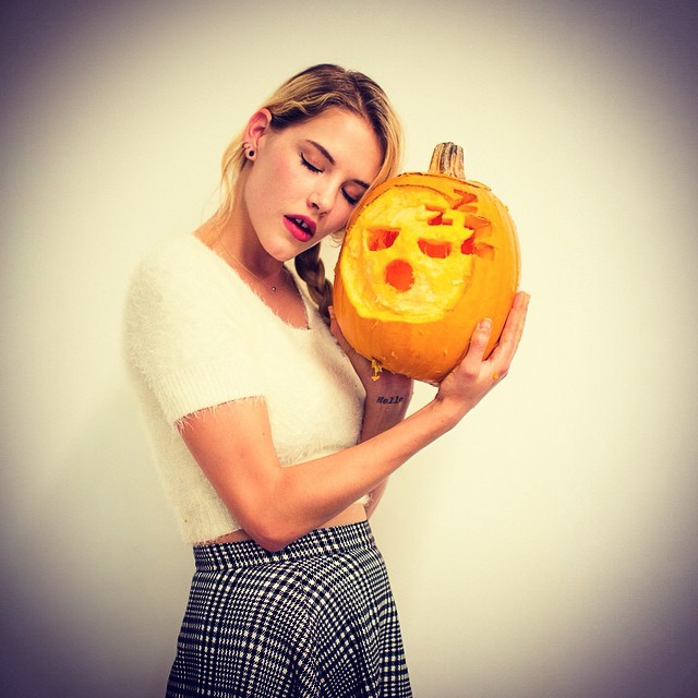 Ashley Smith poses with a carved pumpkin