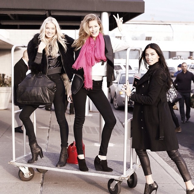 Elsa Hosk, Doutzen Kroes and Adriana Lima has some fun with the luggage carrier