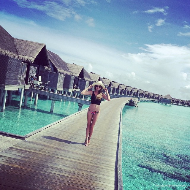 Chrissy Teigen poses in swimsuit while on vacation in the Maldives 