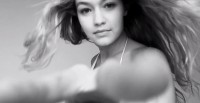 Gigi Hadid Does Hair-Raising Moves in LOVE Advent Video Gigi Hadid Does Hair-Raising Moves in LOVE Advent Video