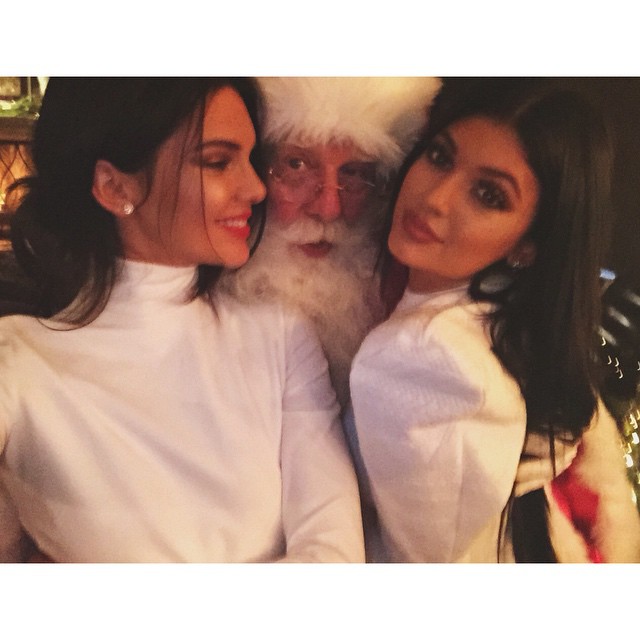 Kendall Jenner and her sister Kylie with Santa