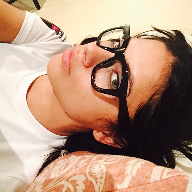 Adriana Lima shows off a black framed pair of glasses