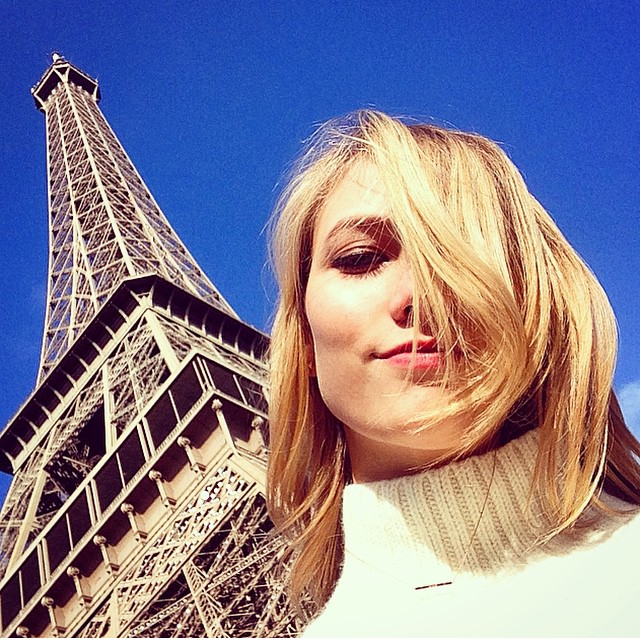 Karlie Kloss takes a selfie near the Eiffel Tower