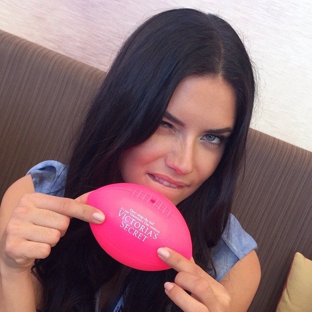 Adriana Lima poses with a pink football at VS event