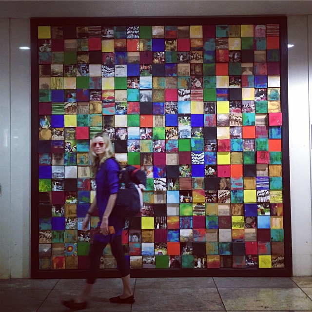Valentina Zelyaeva at the airport with a colorful mural