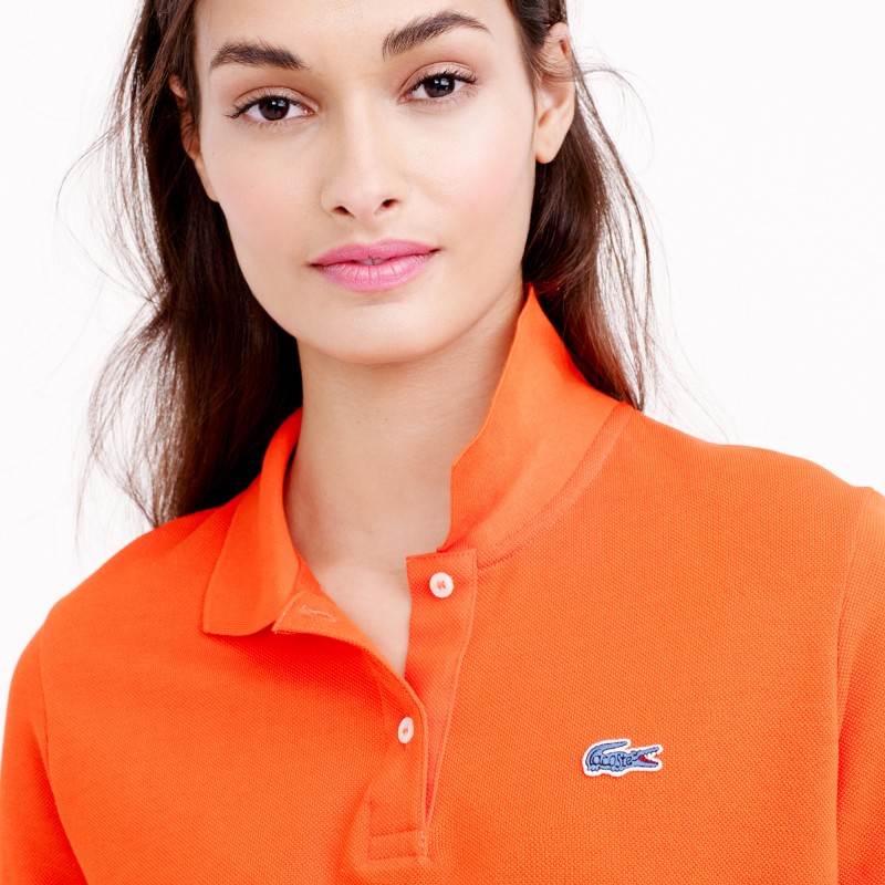 A close-up detail of the Lacoste archive alligator logo.