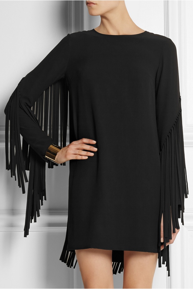 Many designers created fringe embellished pieces the season. DKNY's fringed crepe mini dress is the perfect addition to a wardrobe for going out. Available at Net-a-Porter.