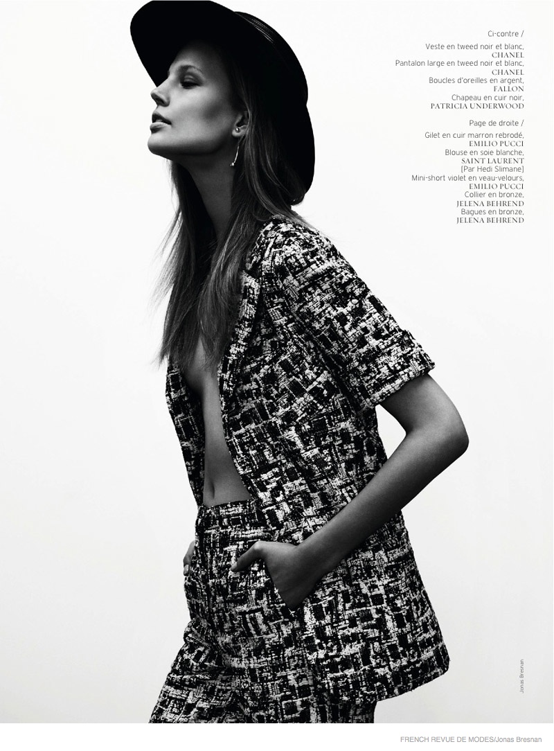 The blonde model dons a Chanel tweed jacket and pants with a hat from Patricia Underwood.