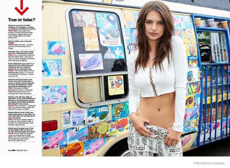 Wearing a sexy crop top look, Emily poses in front of an ice cream truck. 