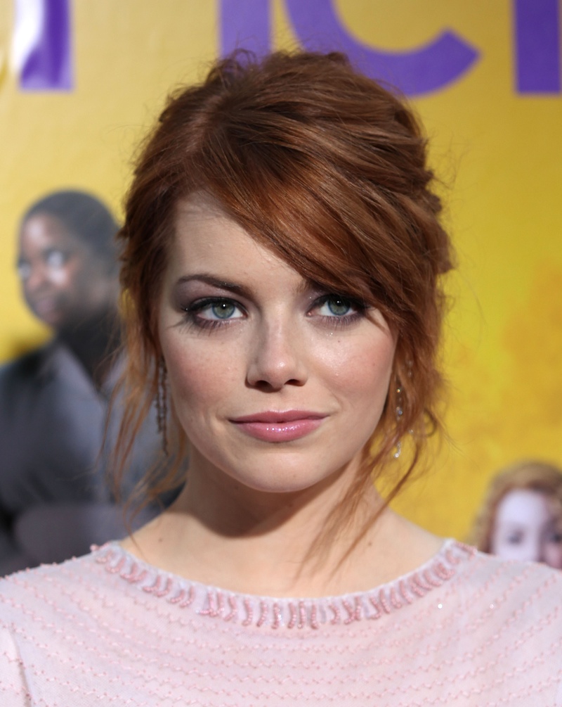 In August 2011, Emma wears a messy updo with her signature red hair in tact. Photo: DFree / Shutterstock.com