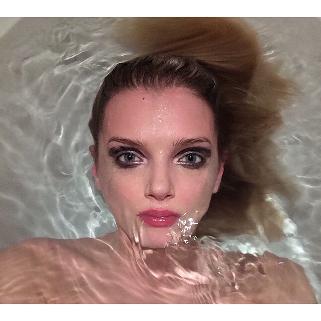 Lily Donaldson washes off her makeup in a bath