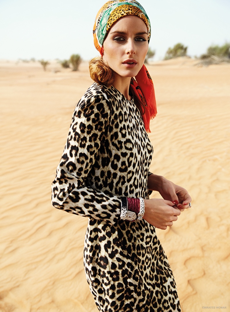 Posing in the desert, Olivia dons a leopard print dress and scarf around her hair. 