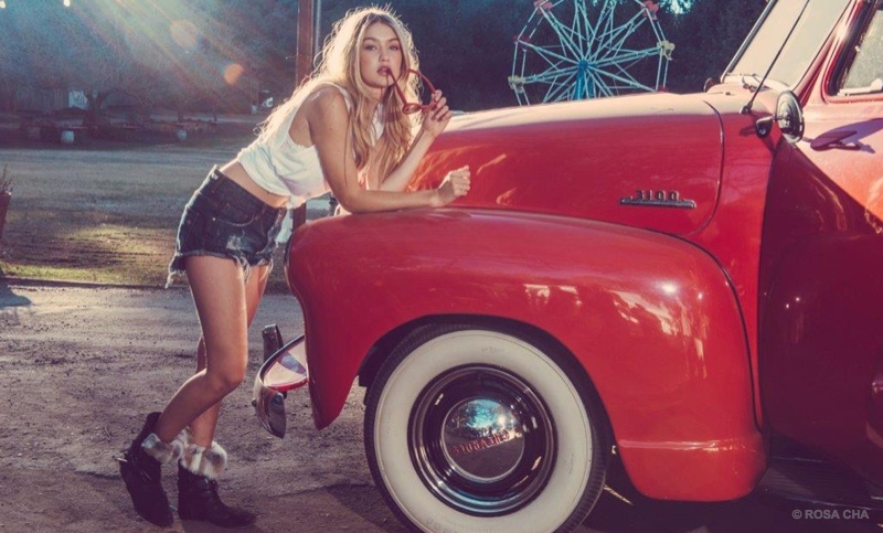 Gigi Hadid wears denim shorts and a white tank in Rosa Cha winter 2015 advertisement.