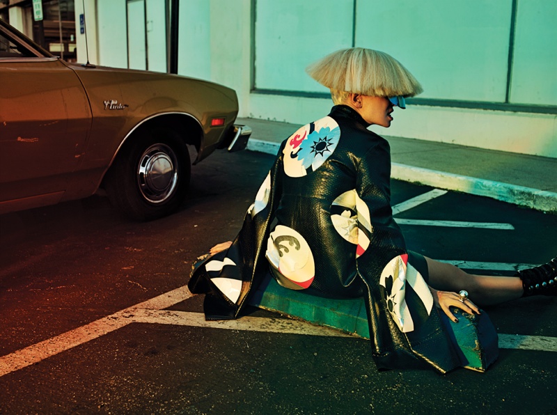 Wearing an Alexander McQueen design, Sia dons a choppy wig. 