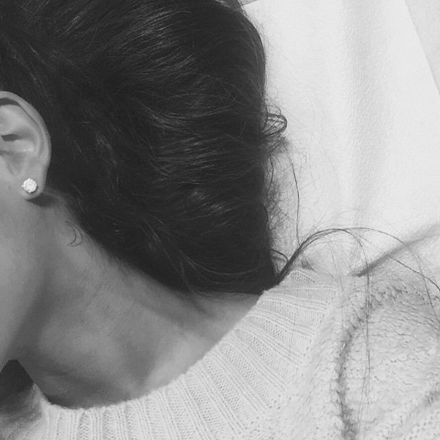 Ariana Grande reveals a new crescent moon tattoo on her neck. Photo via Instagram. 