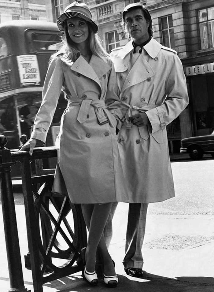 A Burberry advertisement from 1973 featuring models in trench coats