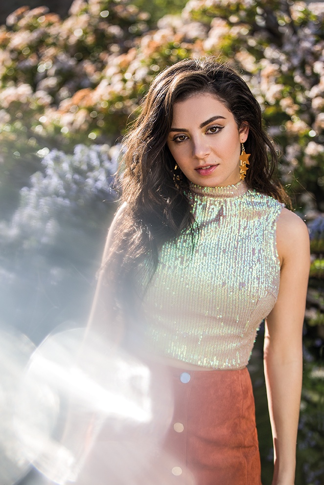 Charli shines in sequins and suede for this image