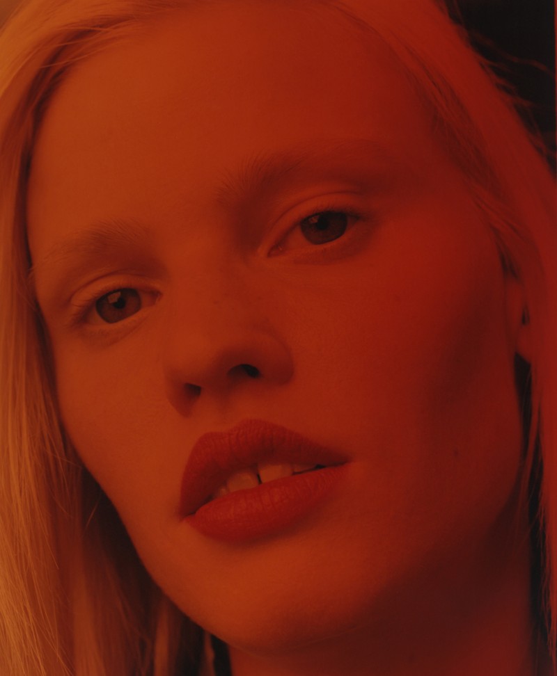 Lara Stone poses for a close-up showing her famous teeth gap.