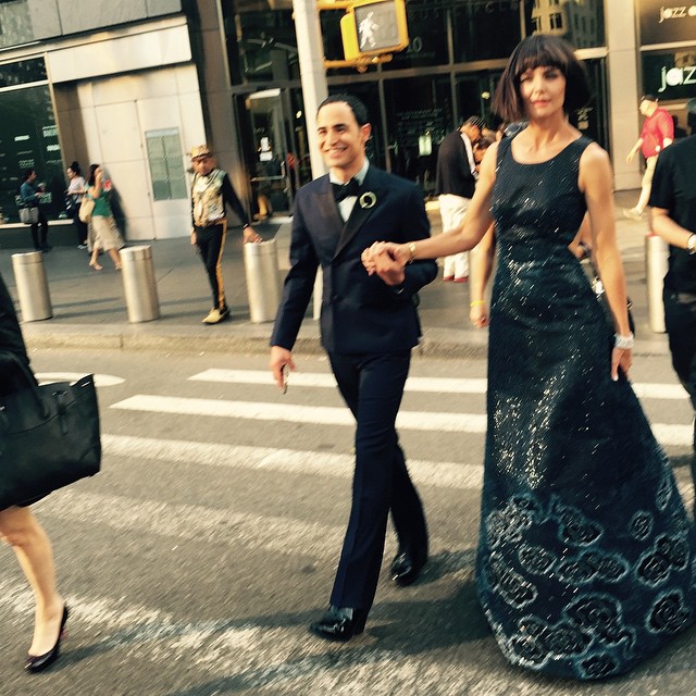 Katie Holmes wears Zac Posen while walking with the designer