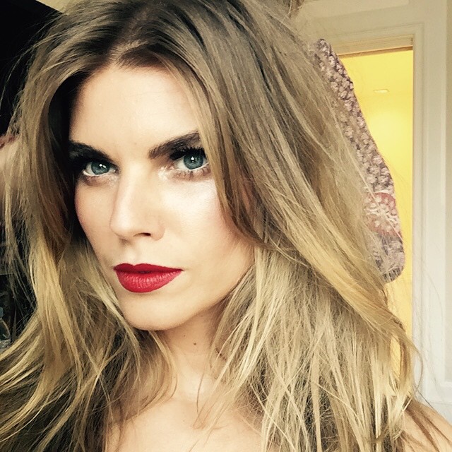 Maryna Linchuk wears a glam red lip