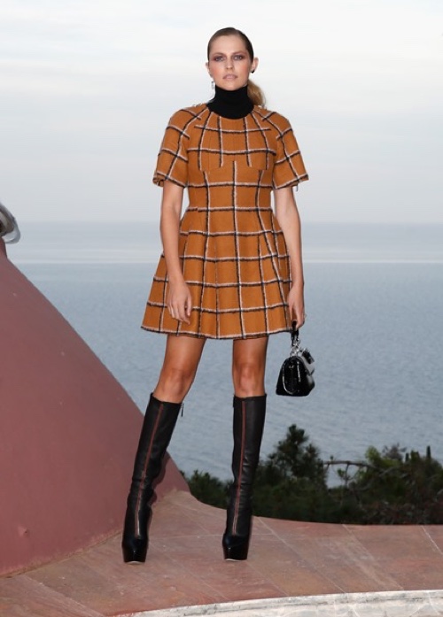Teresa Palmer in a Dior embroidered check camel wool dress with a Dior black knit turtleneck. Photo: Getty Images