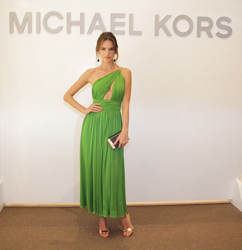 JUNE 2015: Alessandra Ambrosio looks radiant in a green dress at Michael Kors Panama City store opening. Photo: Getty Images for Michael Kors