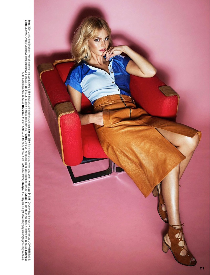 Erin color blocks in a two-tone shirt and brown leather skirt