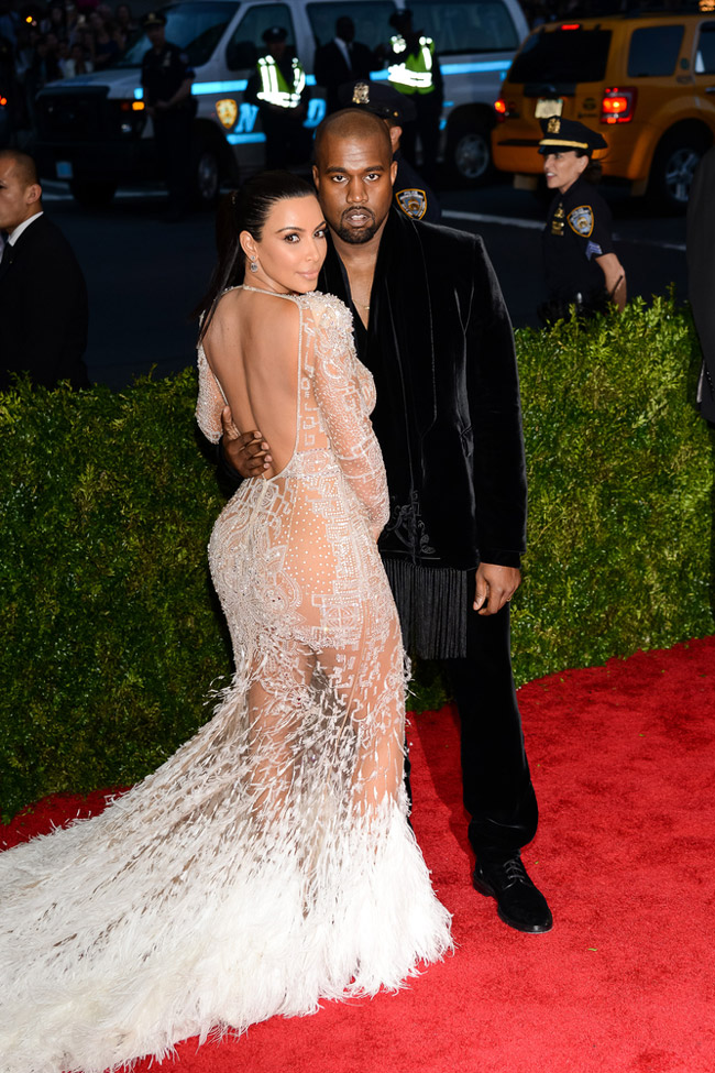 Reality television star Kim Kardashian flaunted her curves in a custom Roberto Cavalli design featuring feathers and crystal galore at the 2015 Met Gala. The brunette went sheer in the body-clinging dress. Photo: Electrolysis / Shutterstock.com